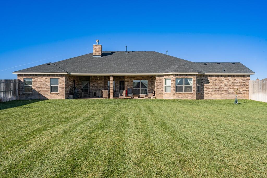 17801 Stone Creek Road Amarillo, TX 79124 - Photo 29 of 31 a front view of a house with a garden
