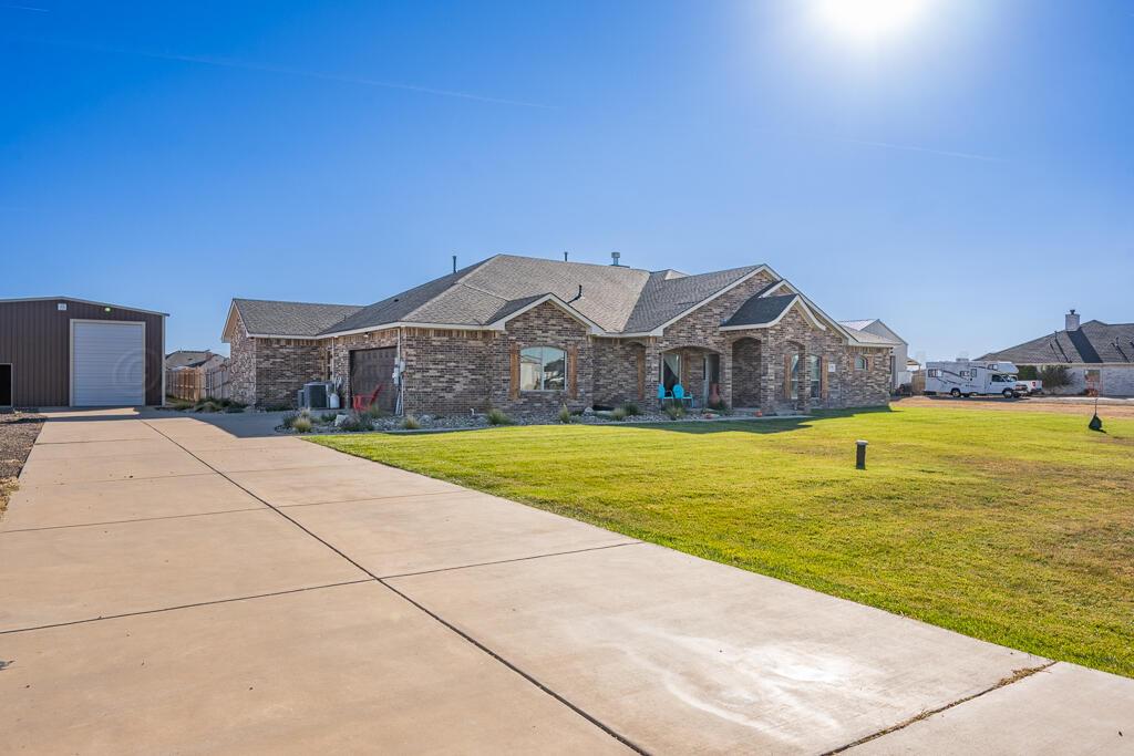 17801 Stone Creek Road Amarillo, TX 79124 - Photo 3 of 31 a view of houses with swimming pool in front of house