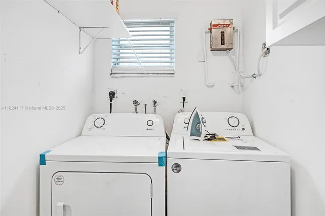 a utility room with dryer and washer