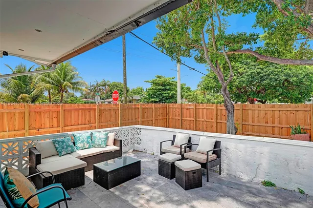 a patio with patio a couch and chairs