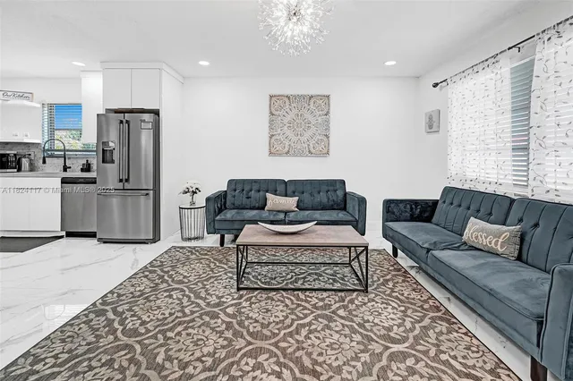 a living room with furniture and a rug