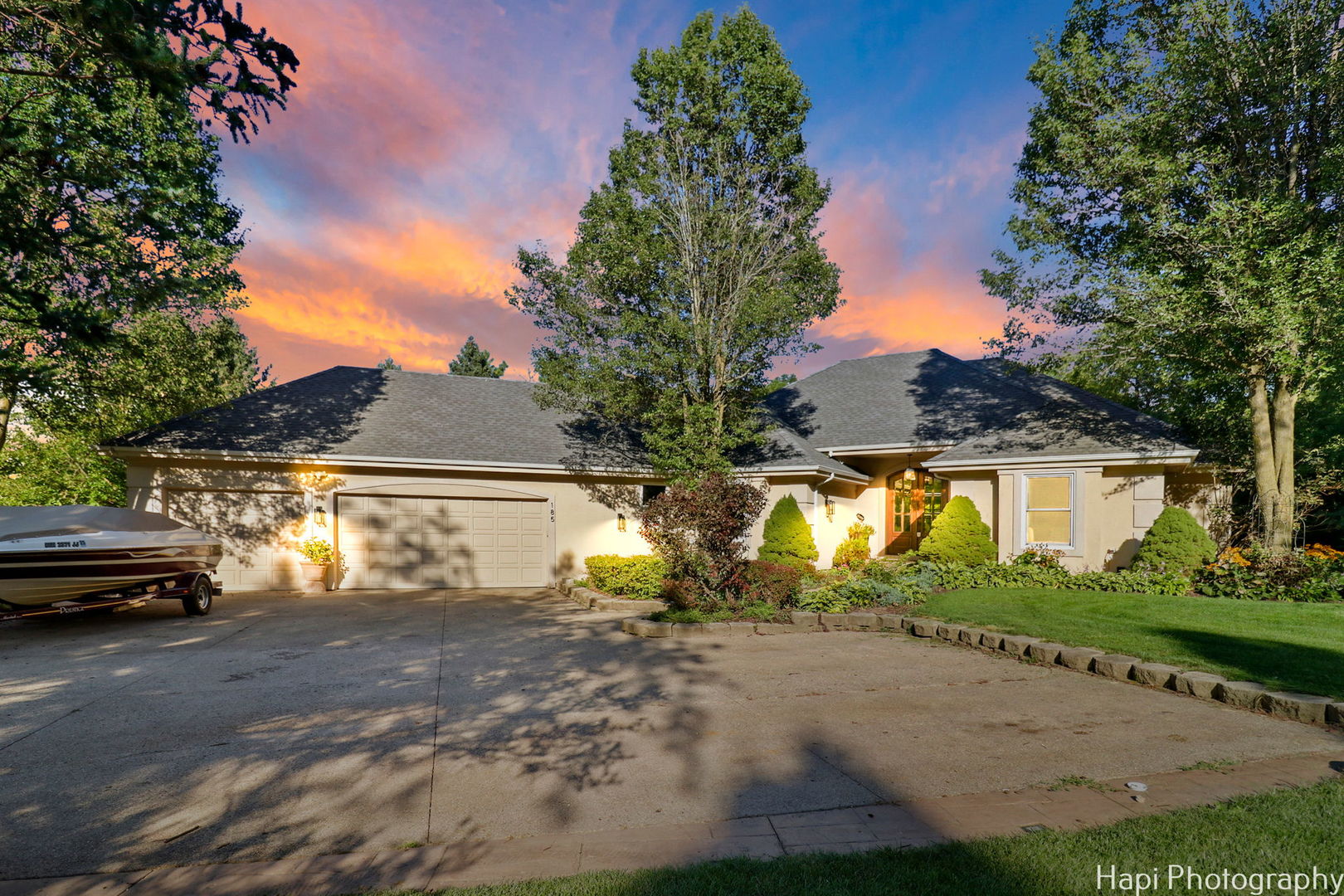 a view of a street with a house in the background
