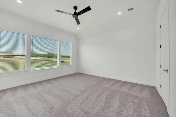 an empty room with a empty space and windows