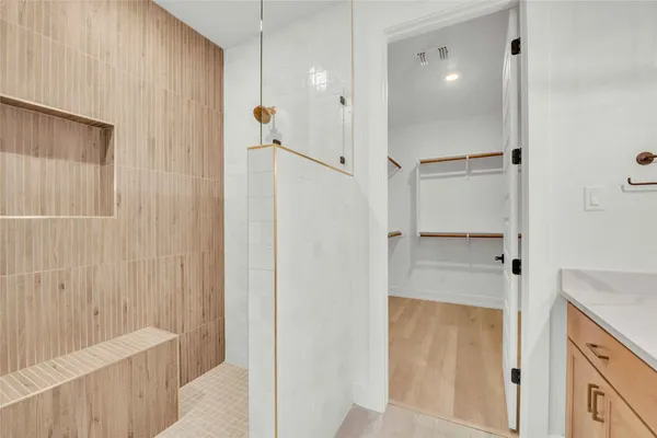 a bathroom with a shower and a tub