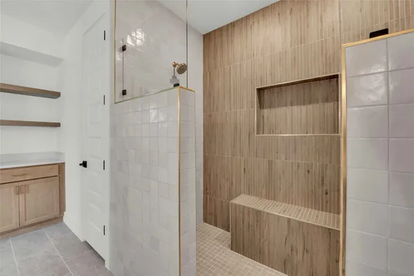 a bathroom with a shower and a tub