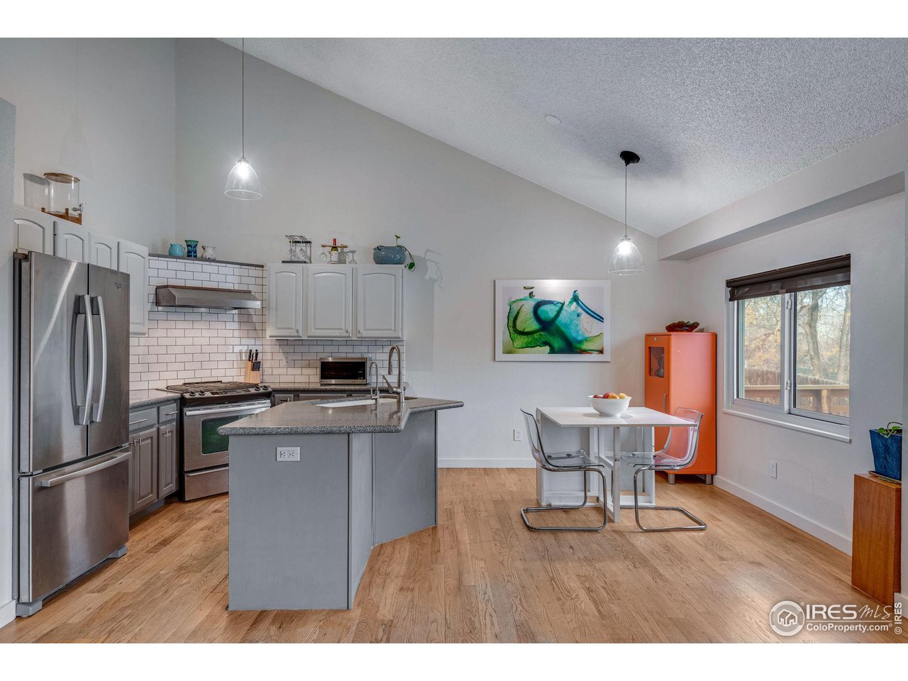 908 Clover Circle Lafayette, CO 80026 - Photo 11 of 40 a kitchen with a sink stainless steel appliances and cabinets