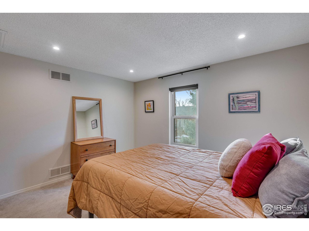908 Clover Circle Lafayette, CO 80026 - Photo 24 of 40 a bedroom with a bed and a painting