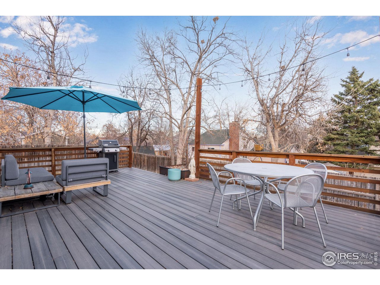 908 Clover Circle Lafayette, CO 80026 - Photo 35 of 40 a lawn chairs sitting on a wooden roof with wooden floor