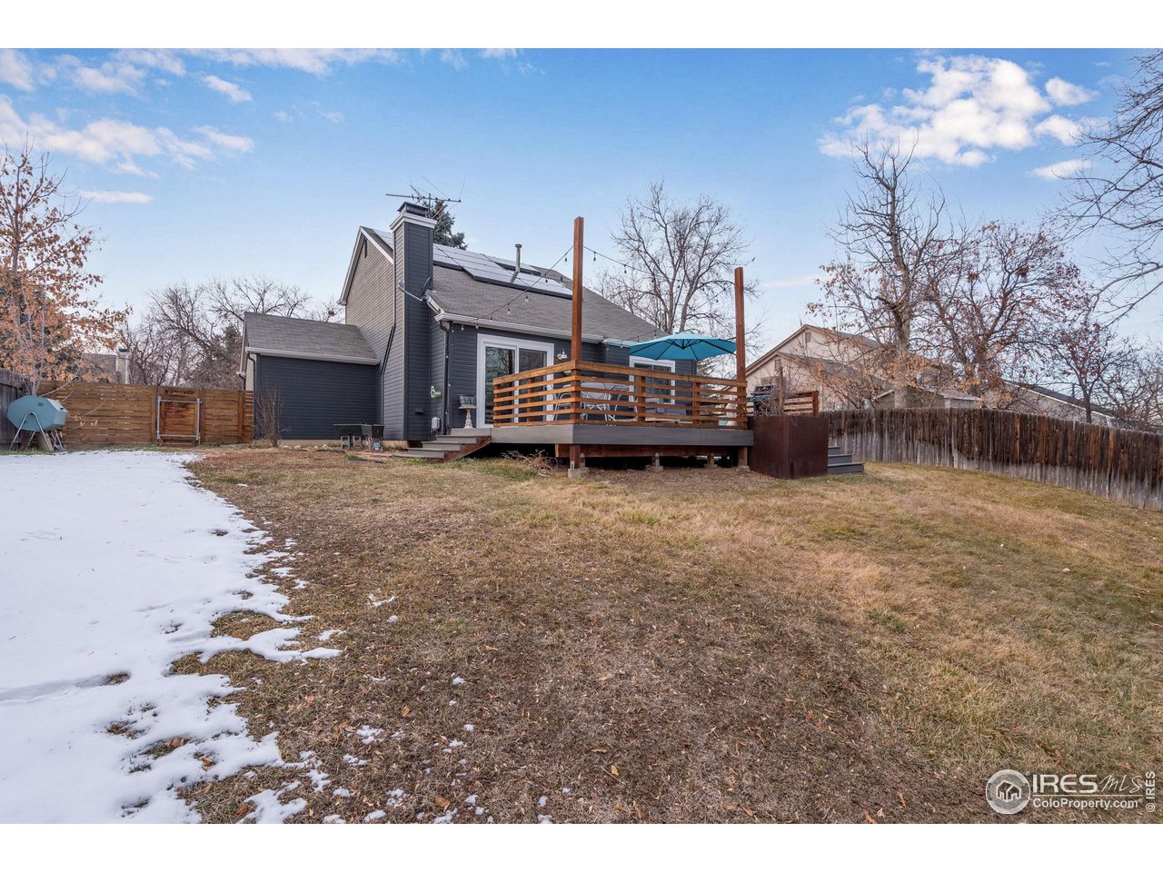 908 Clover Circle Lafayette, CO 80026 - Photo 40 of 40 a view of a house with a yard covered in snow