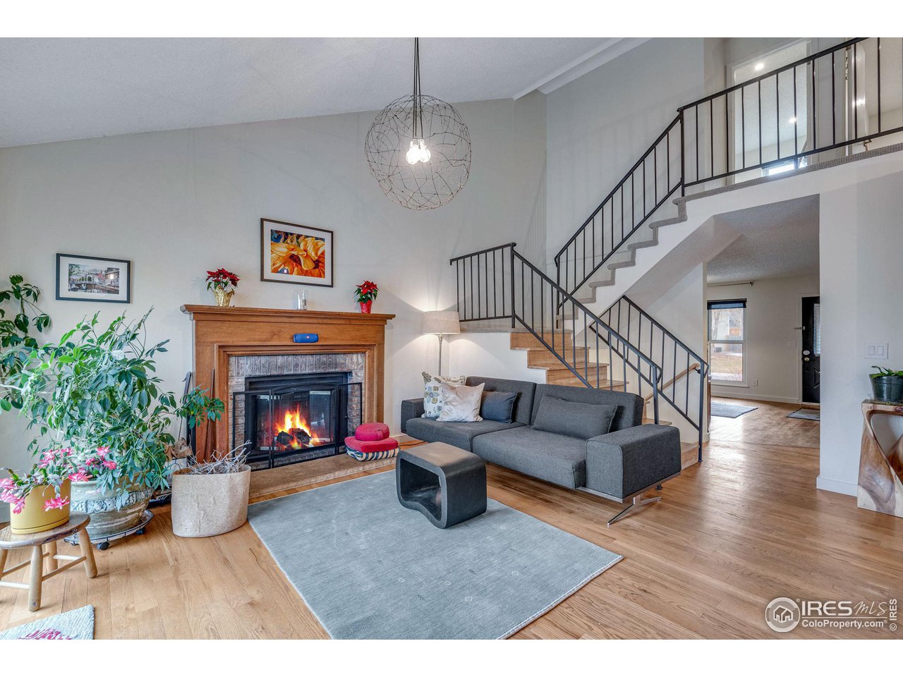 908 Clover Circle Lafayette, CO 80026 - Photo 4 of 40 a living room with furniture and a fireplace
