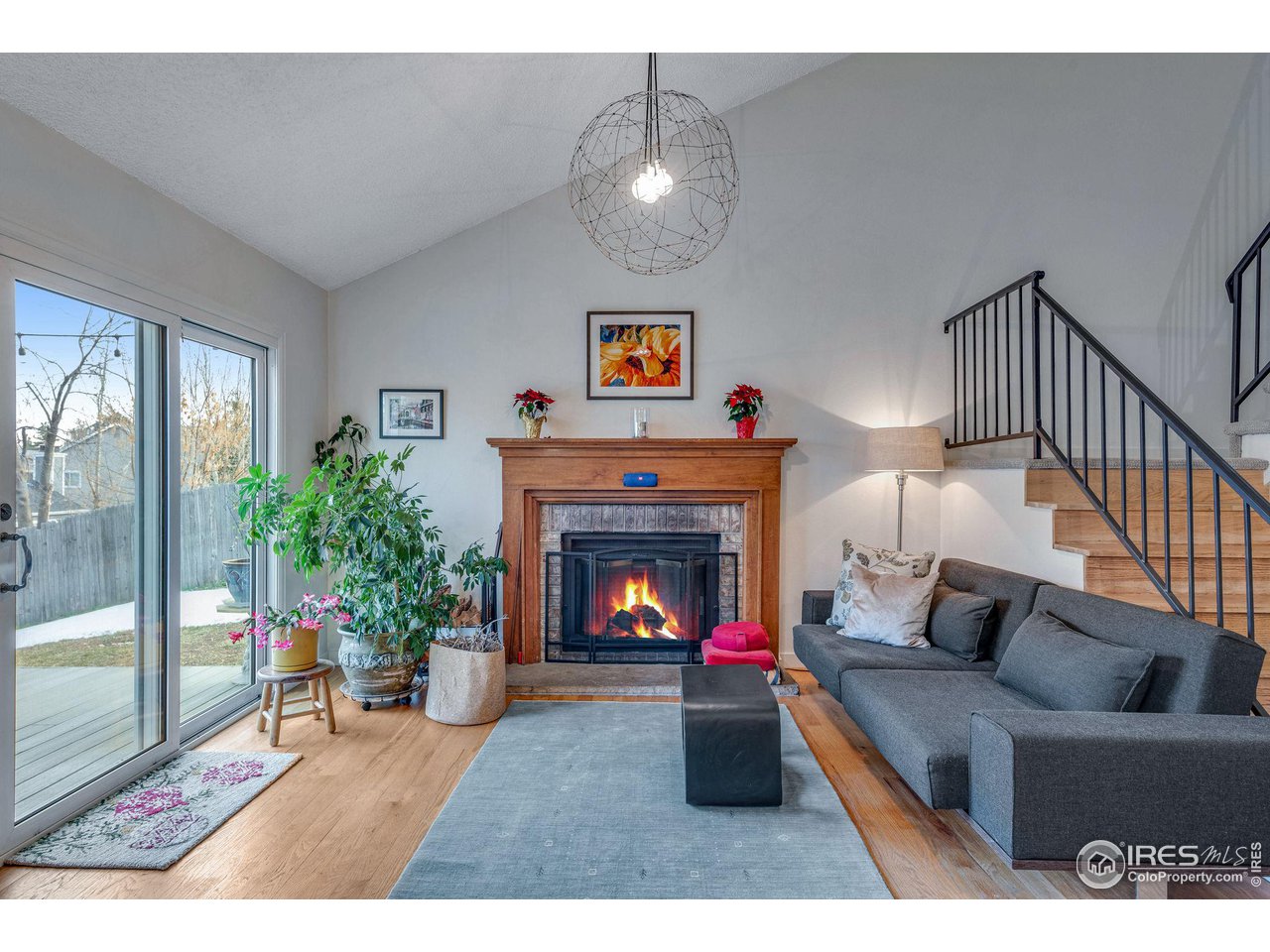 908 Clover Circle Lafayette, CO 80026 - Photo 5 of 40 a living room with furniture and a fireplace
