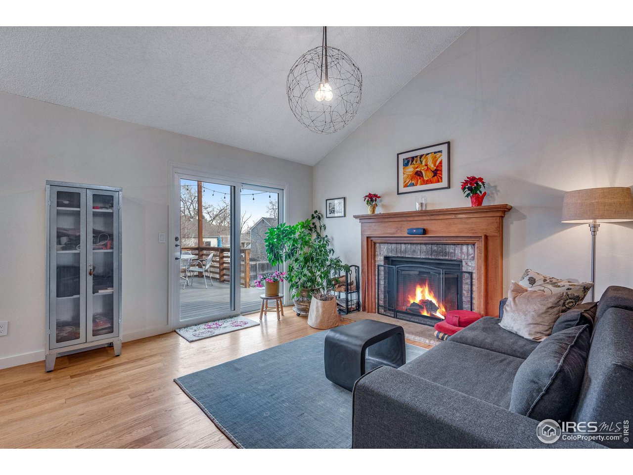 908 Clover Circle Lafayette, CO 80026 - Photo 6 of 40 a living room with furniture and a fireplace