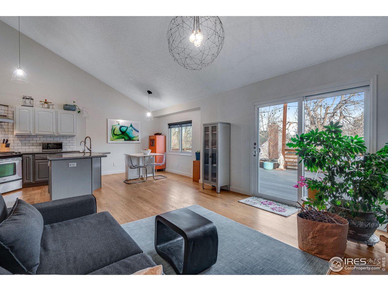 908 Clover Circle Lafayette, CO 80026 - Photo 7 of 40 a living room with furniture and a potted plant