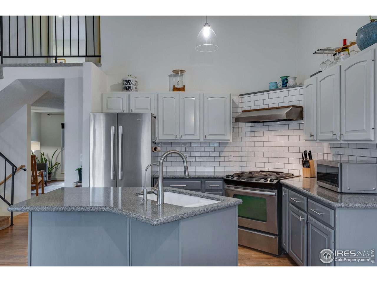 908 Clover Circle Lafayette, CO 80026 - Photo 9 of 40 a kitchen with stainless steel appliances a sink stove and cabinets