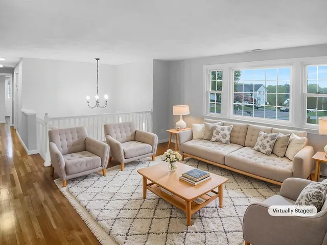 a living room with furniture and a table