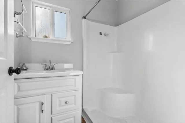 a view of hallway with chandelier