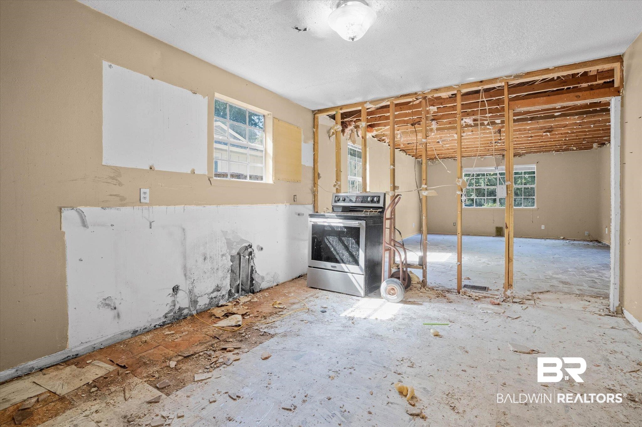 401 Frederick Avenue Fairhope, AL 36532 - Photo 6 of 36 Open concept interior featuring exposed wall studs and subflooring