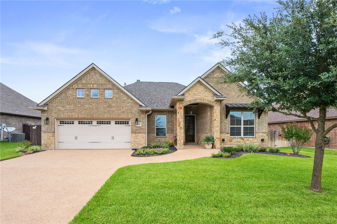 3048 Archer Circle Bryan, TX 77808 - Photo 1 of 1 View of front of home featuring brick siding, stone siding, and concrete driveway