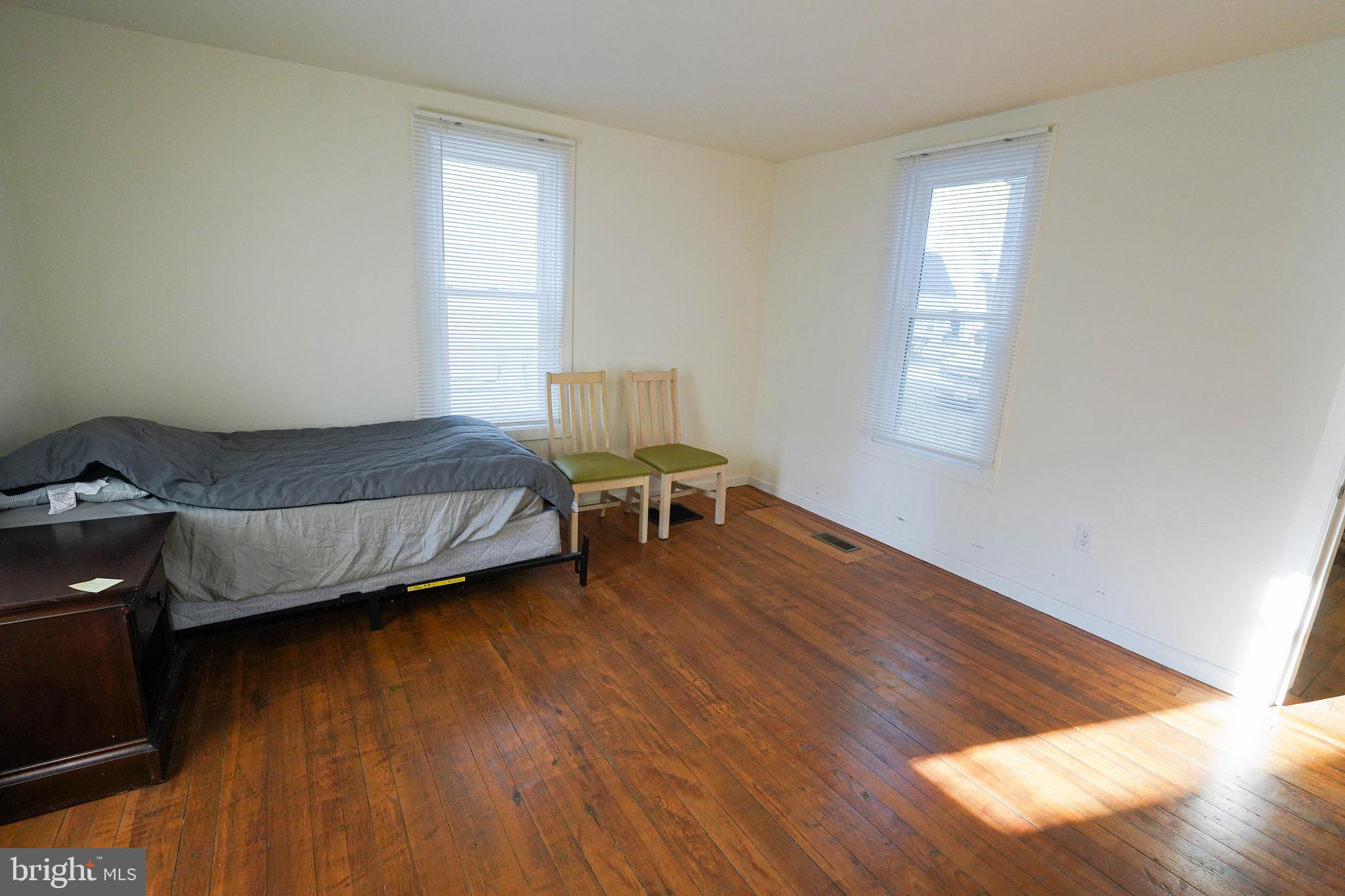 231 Newton Street, Unit A Salisbury, MD 21801 - Photo 11 of 38 a living room with a bed furniture and a window
