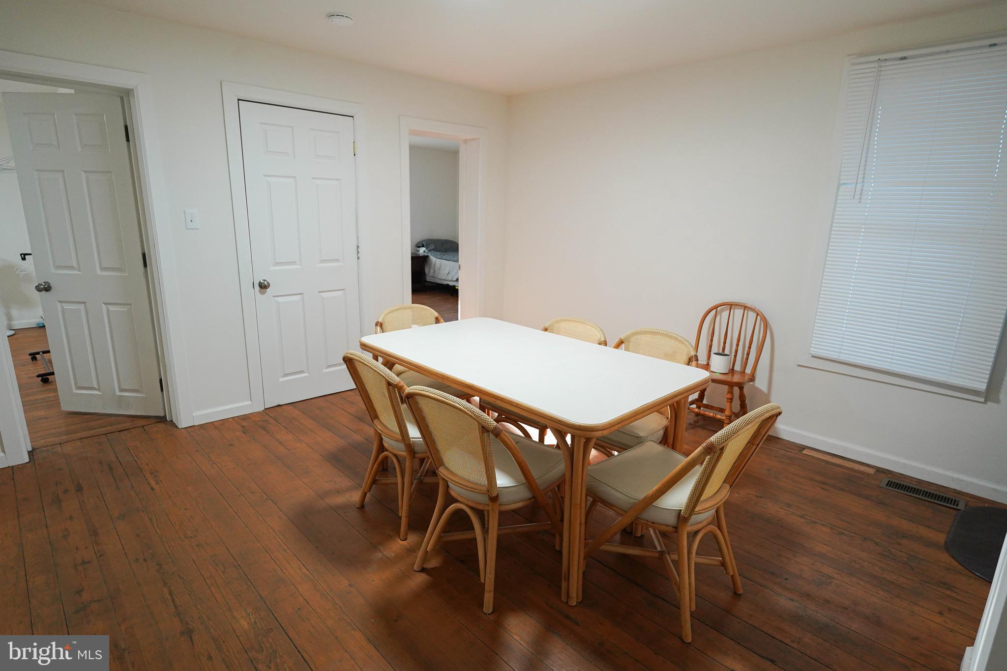 231 Newton Street, Unit A Salisbury, MD 21801 - Photo 13 of 38 a view of a dining room with furniture and wooden floor