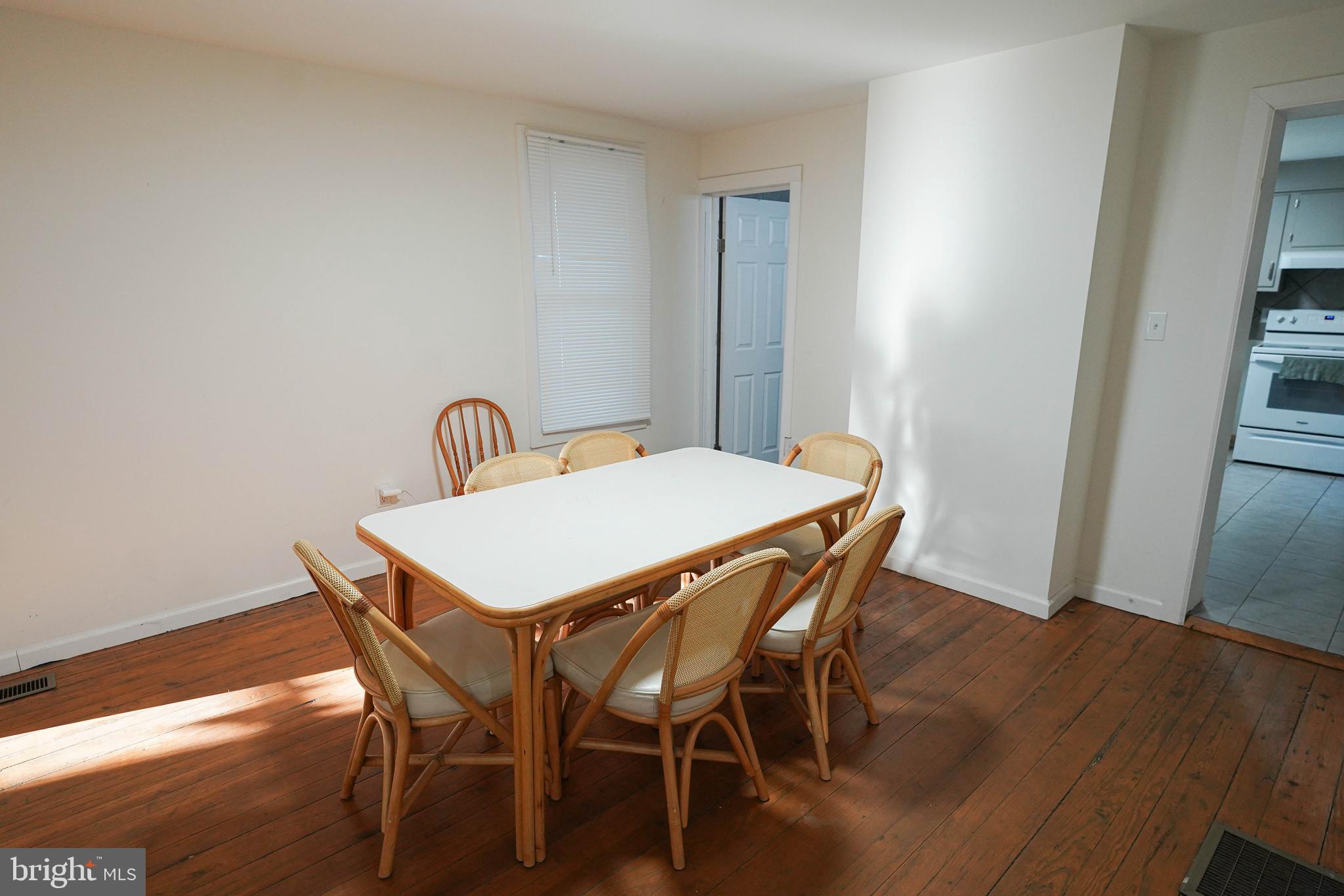 231 Newton Street, Unit A Salisbury, MD 21801 - Photo 14 of 38 a view of a dining room with furniture and wooden floor