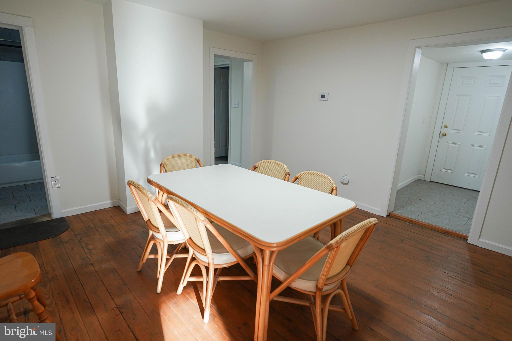 231 Newton Street, Unit A Salisbury, MD 21801 - Photo 15 of 38 a view of a dining room with furniture and wooden floor