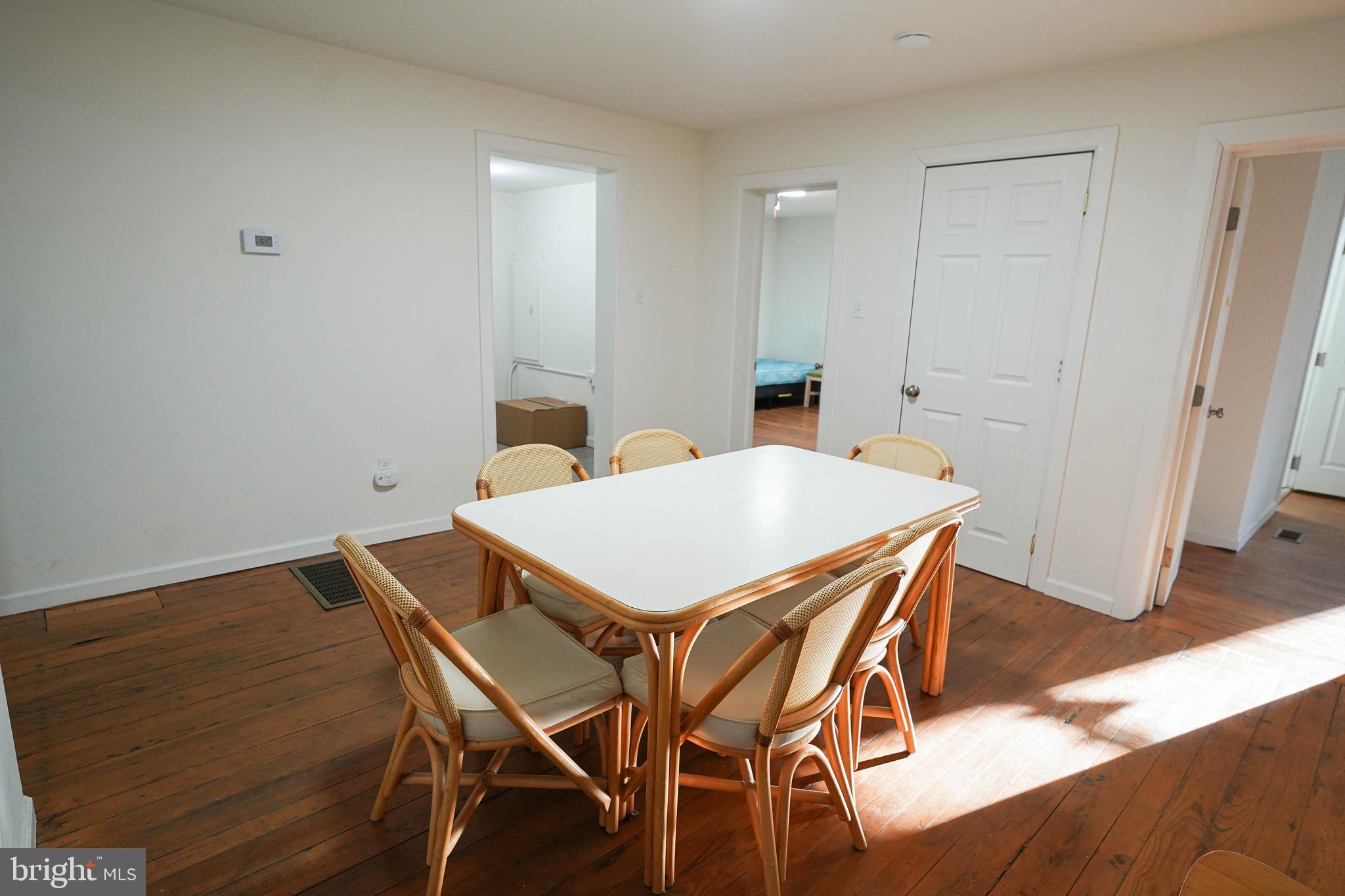 231 Newton Street, Unit A Salisbury, MD 21801 - Photo 16 of 38 a view of a dining room with furniture and wooden floor