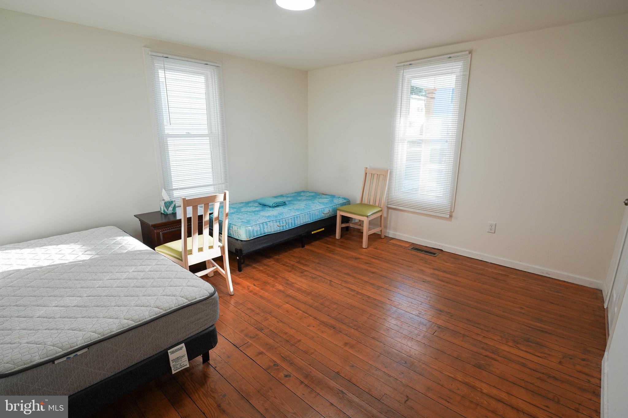 231 Newton Street, Unit A Salisbury, MD 21801 - Photo 21 of 38 a bedroom with furniture and wooden floor