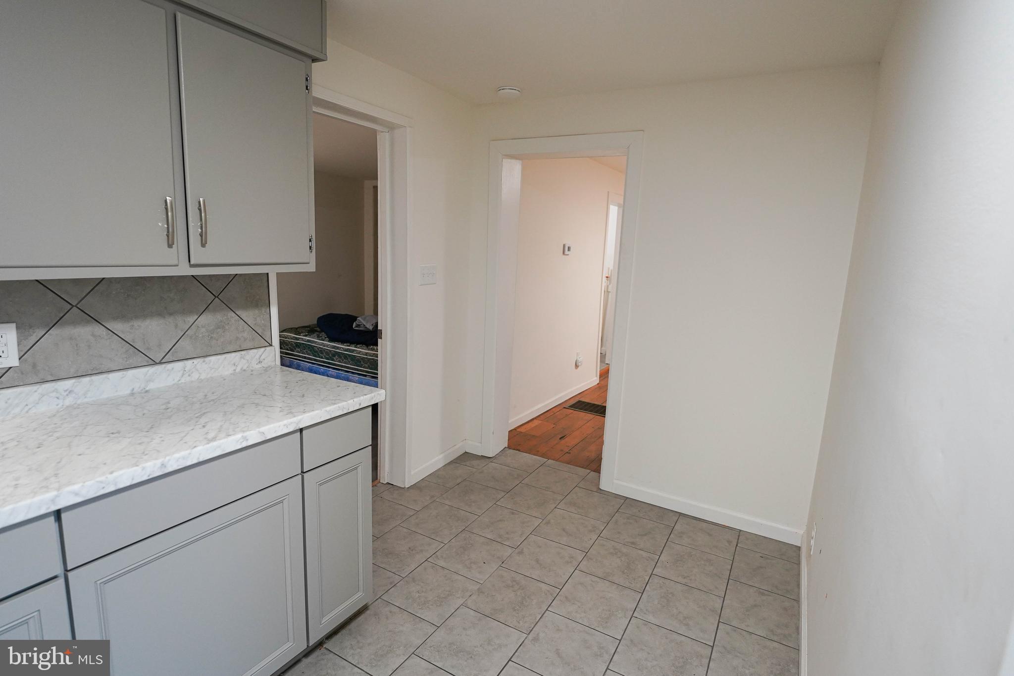 231 Newton Street, Unit A Salisbury, MD 21801 - Photo 33 of 38 a kitchen with a sink and cabinets