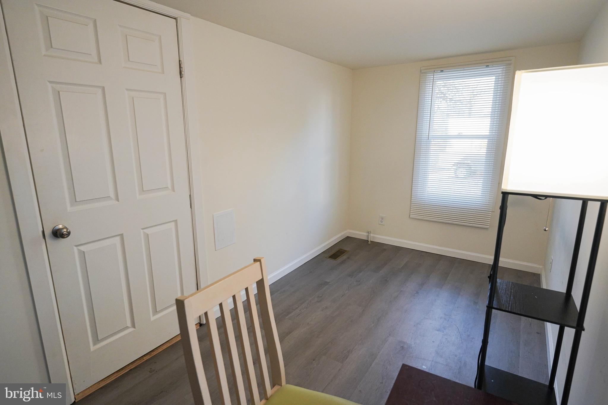 231 Newton Street, Unit A Salisbury, MD 21801 - Photo 38 of 38 a view of wooden floor and chair in a room