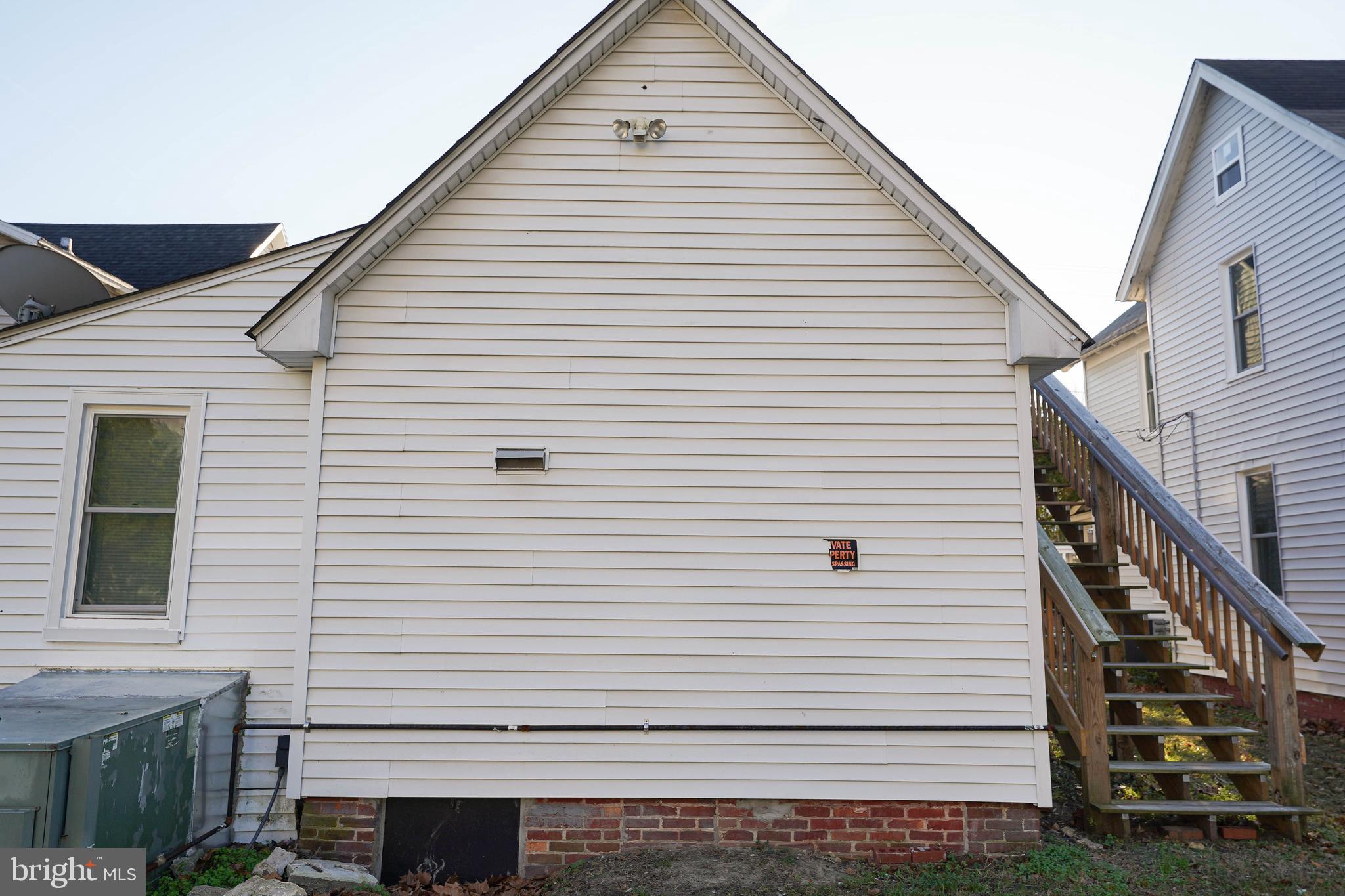 231 Newton Street, Unit A Salisbury, MD 21801 - Photo 5 of 38 a view of a white house with many windows