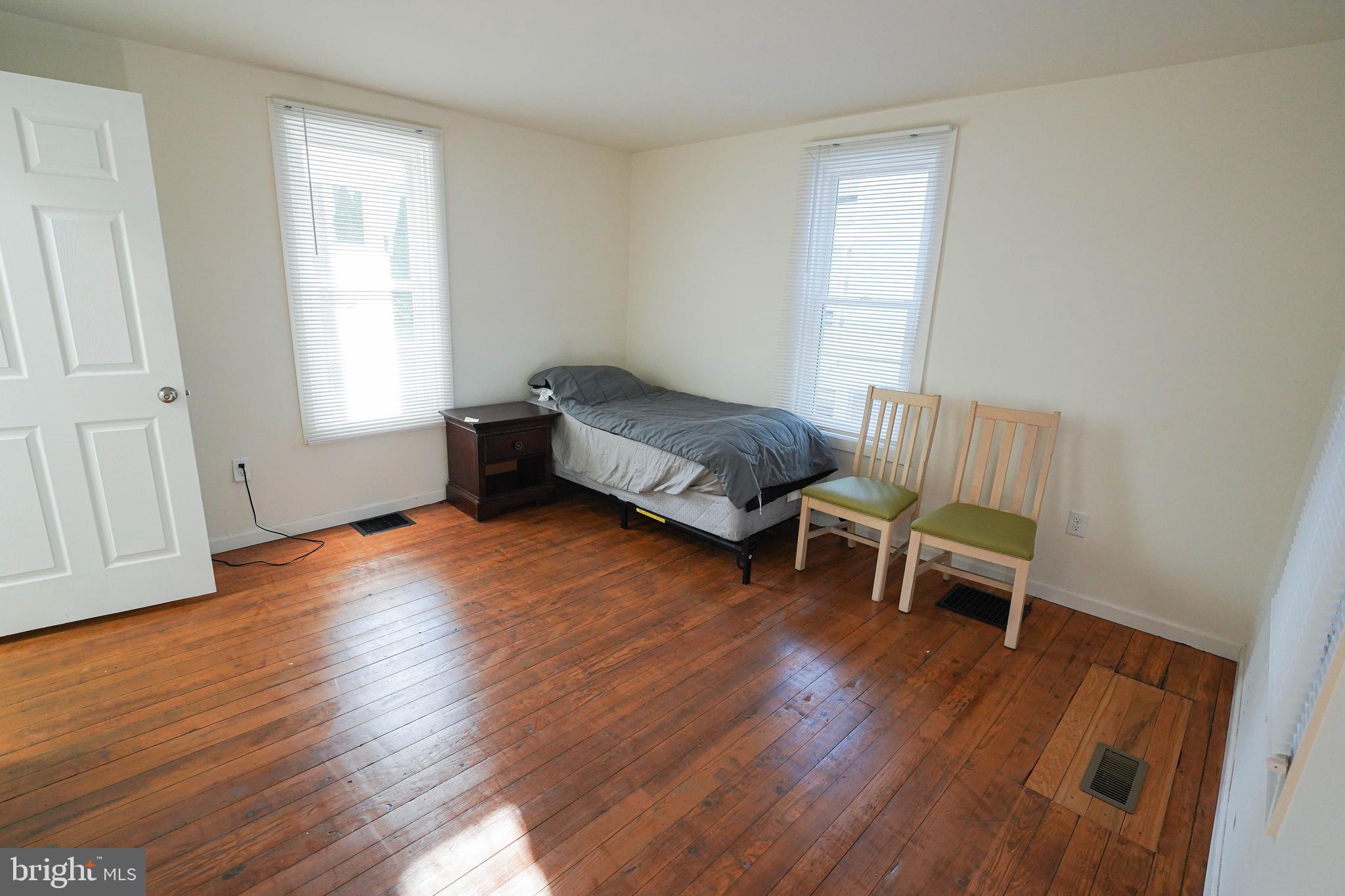 231 Newton Street, Unit A Salisbury, MD 21801 - Photo 10 of 38 a living room with furniture and a wooden floor