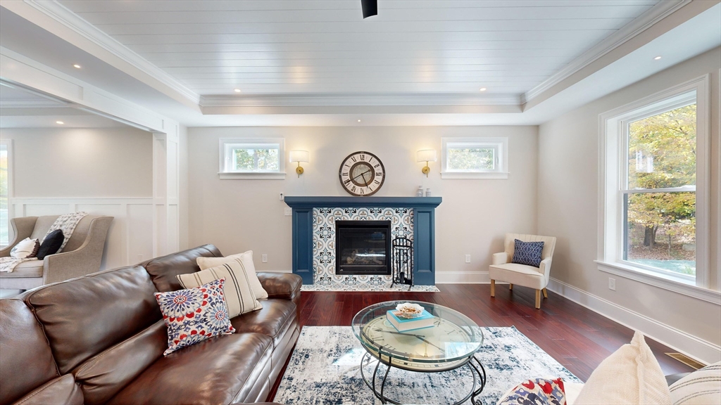 8 Charles Street North Reading, MA 01864 - Photo 11 of 42 a living room with furniture a fireplace and window