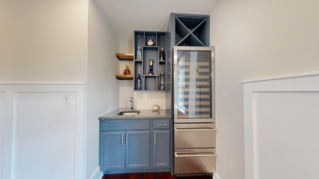8 Charles Street North Reading, MA 01864 - Photo 13 of 42 a kitchen with a refrigerator and cabinets