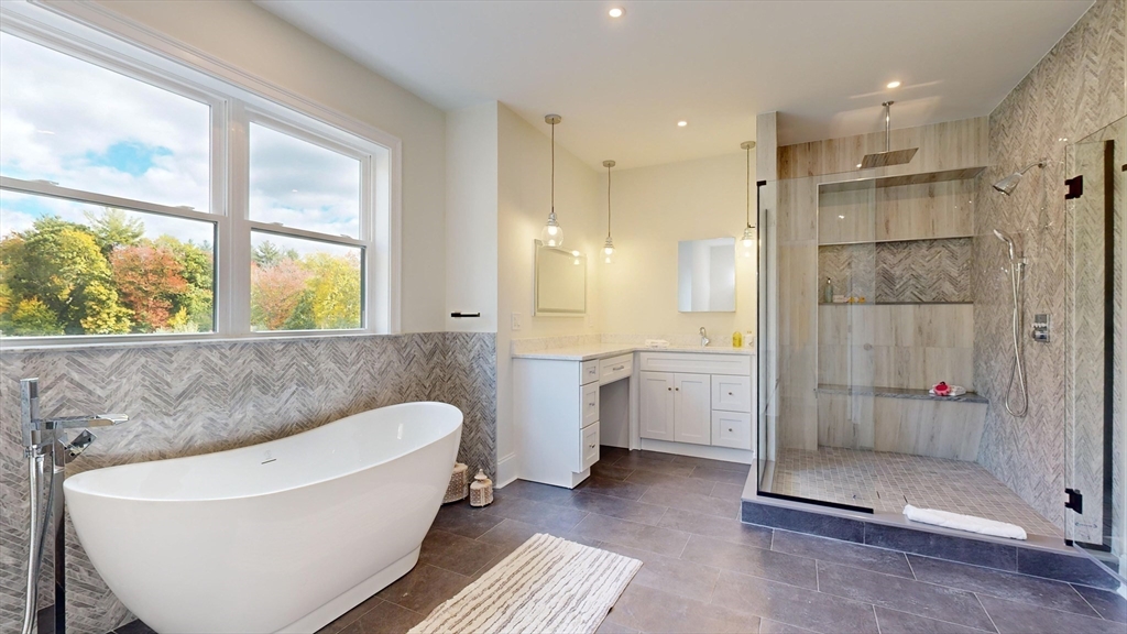 8 Charles Street North Reading, MA 01864 - Photo 20 of 42 a bathroom with a bathtub and a shower