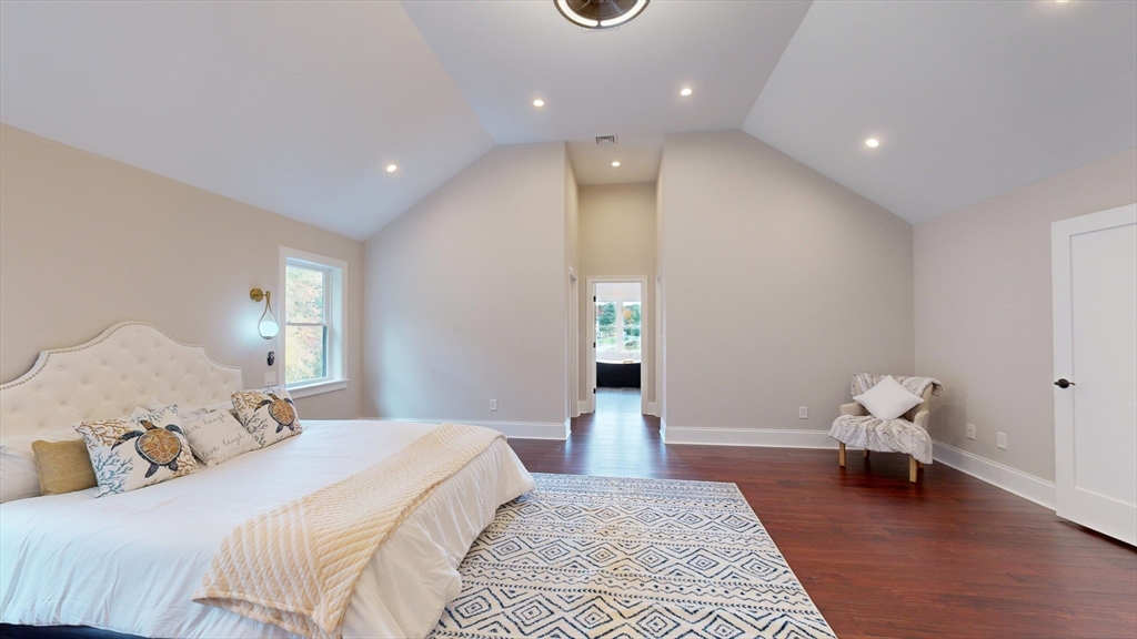 8 Charles Street North Reading, MA 01864 - Photo 22 of 42 a spacious bedroom with a bed and wooden floor