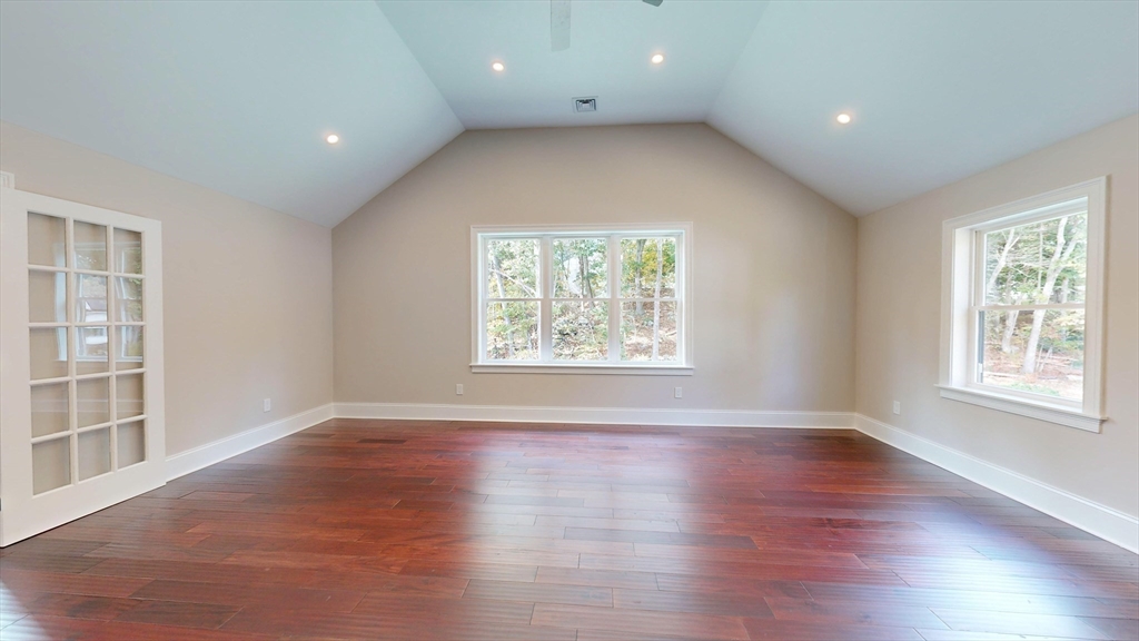 8 Charles Street North Reading, MA 01864 - Photo 25 of 42 an empty room with wooden floor and windows
