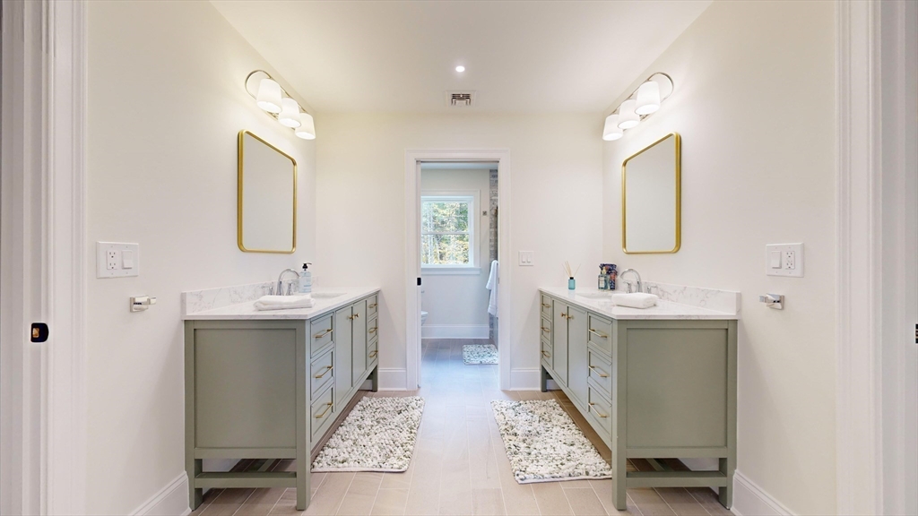 8 Charles Street North Reading, MA 01864 - Photo 31 of 42 a bathroom with a double vanity sink mirror and bathtub