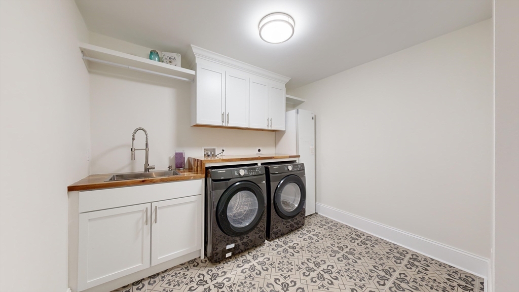 8 Charles Street North Reading, MA 01864 - Photo 35 of 42 a utility room with sink dryer and washer