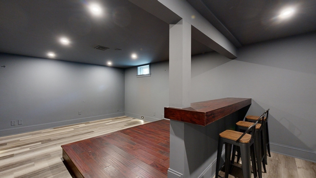 8 Charles Street North Reading, MA 01864 - Photo 38 of 42 a room with wooden floor and furniture
