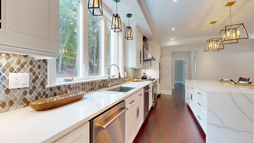 8 Charles Street North Reading, MA 01864 - Photo 4 of 42 a large white kitchen with a large window