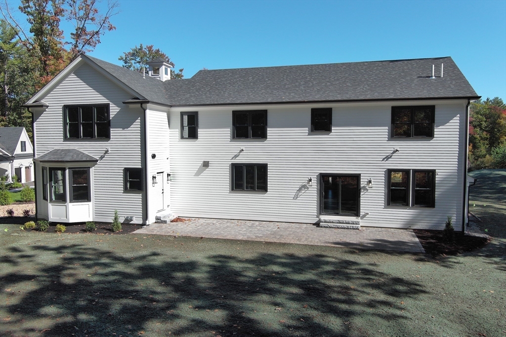 8 Charles Street North Reading, MA 01864 - Photo 41 of 42 a front view of a house with a yard