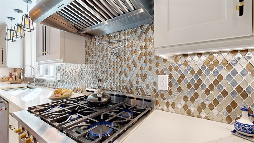 8 Charles Street North Reading, MA 01864 - Photo 7 of 42 a kitchen with a stove and a sink