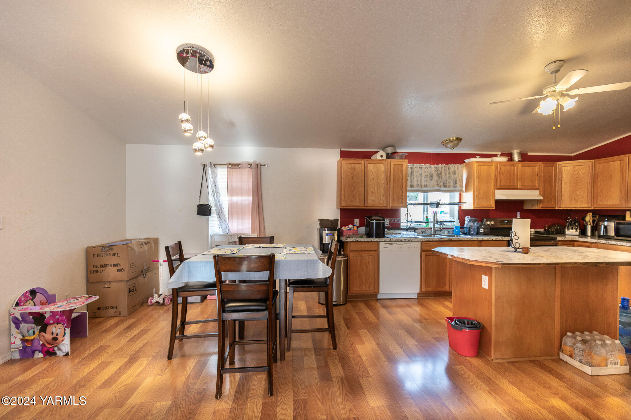 2802 Beaudry Road, Unit 57 Yakima, WA 98901 - Photo 7 of 17 a kitchen with a table and chairs in it