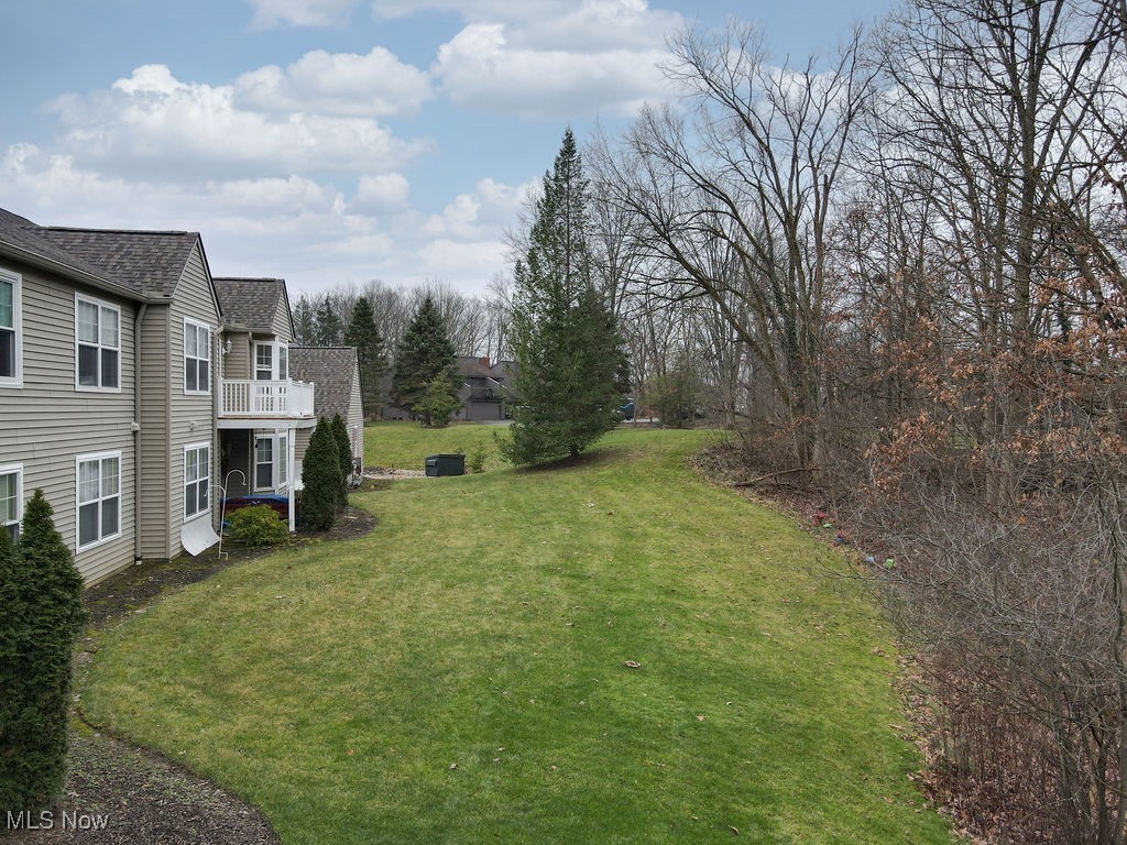 1005 Canyon View Road, Unit F Northfield, OH 44067 - Photo 19 of 28 View of yard featuring a balcony