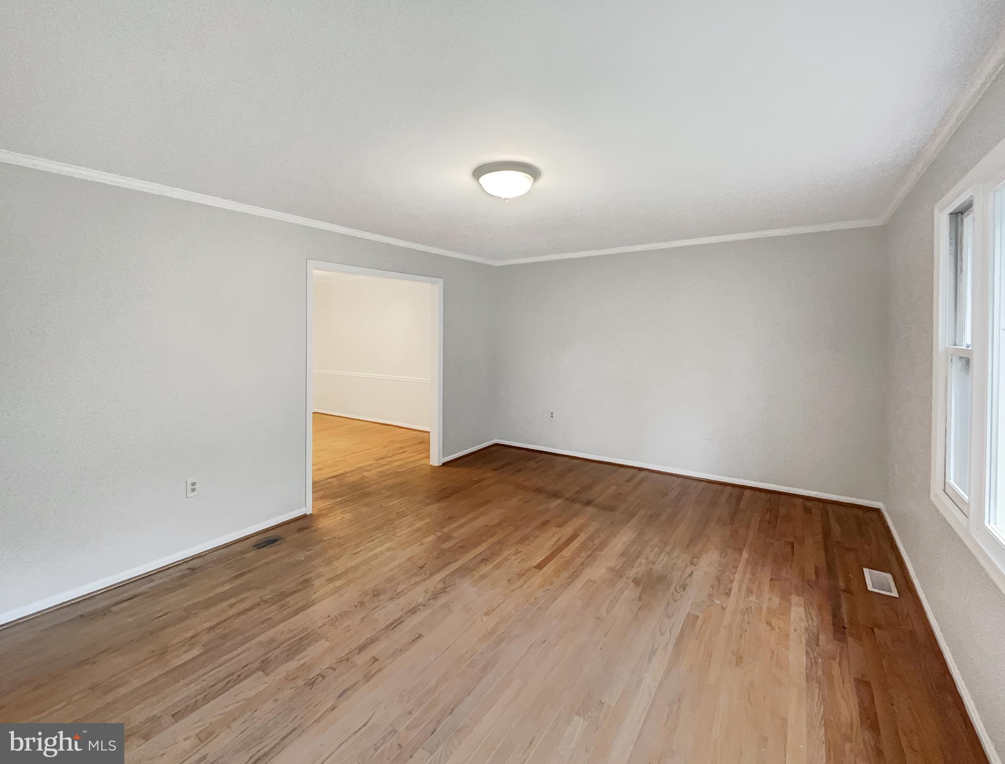 13109 Mica Court Silver Spring, MD 20904 - Photo 11 of 25 an empty room with wooden floor