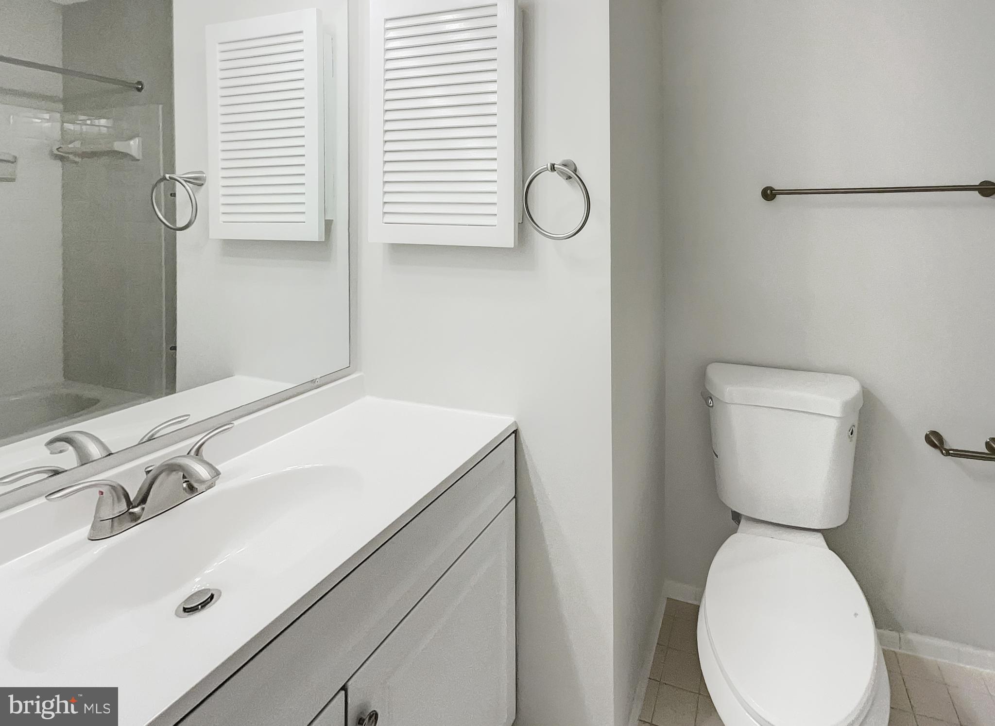 13109 Mica Court Silver Spring, MD 20904 - Photo 16 of 25 a bathroom with a sink and a toilet