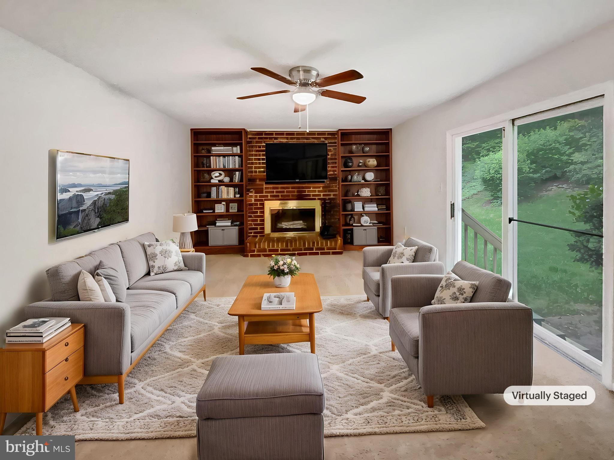 13109 Mica Court Silver Spring, MD 20904 - Photo 2 of 25 a living room with fireplace furniture and a large window