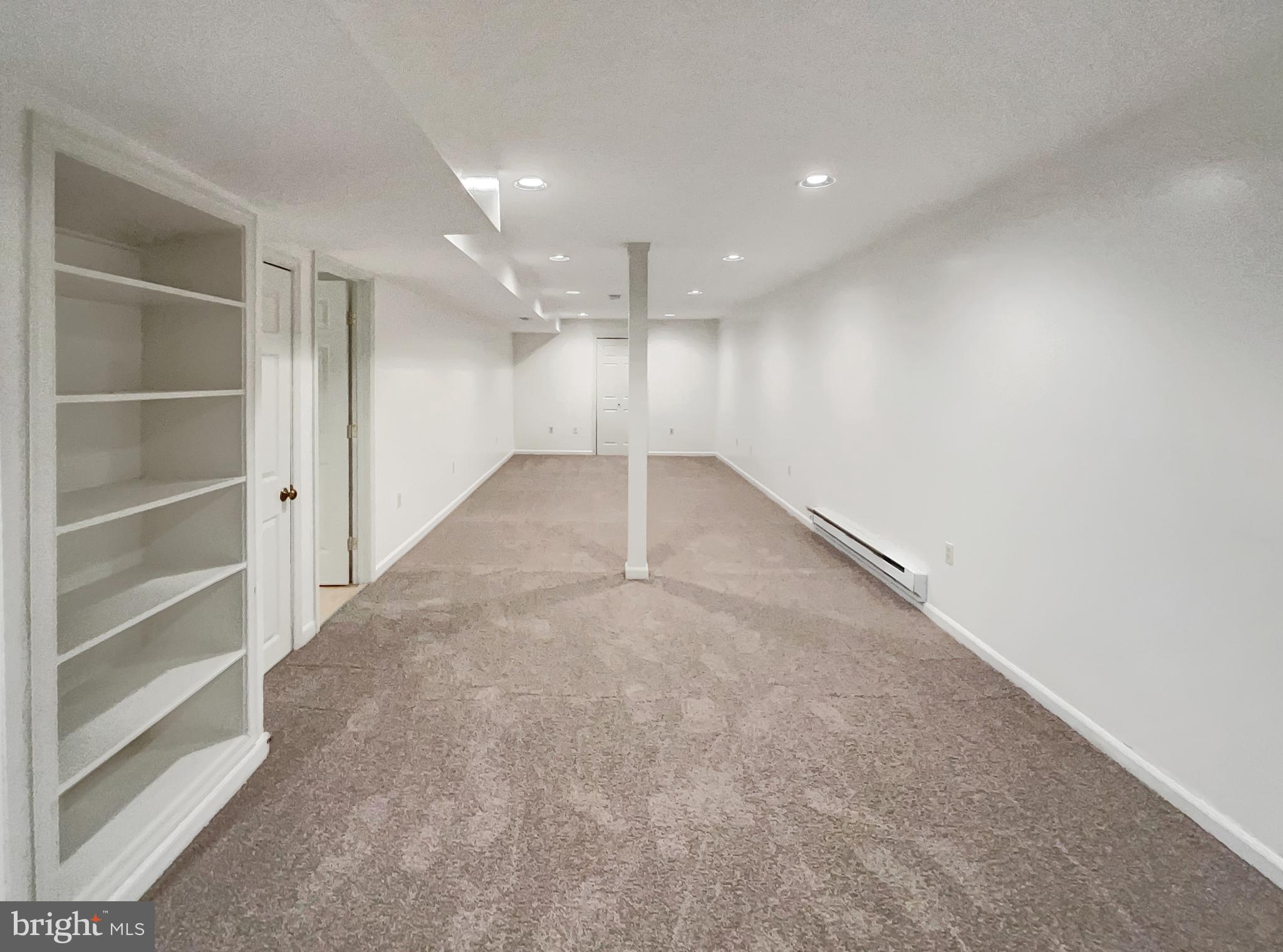 13109 Mica Court Silver Spring, MD 20904 - Photo 21 of 25 a view of an empty room with a cabinet
