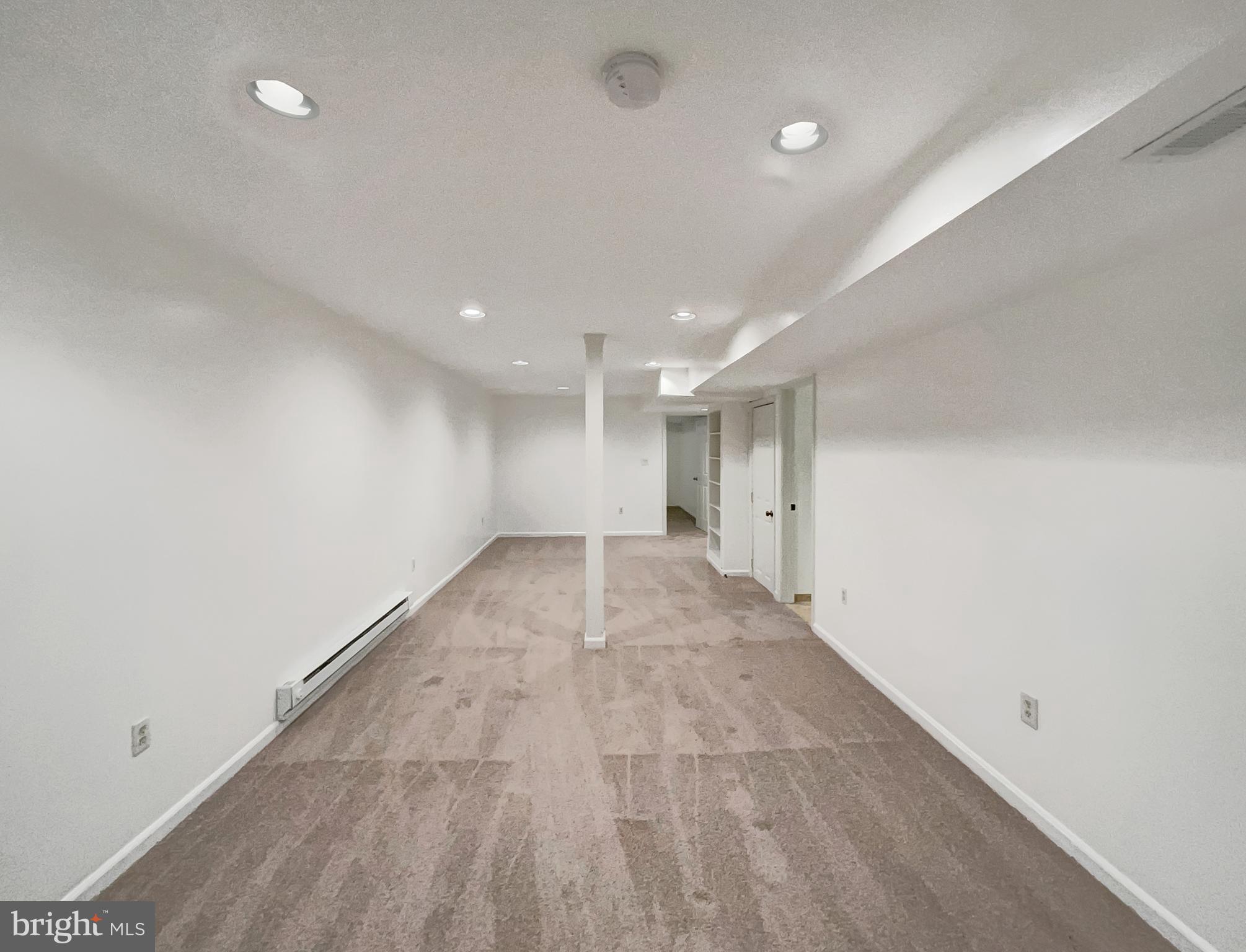 13109 Mica Court Silver Spring, MD 20904 - Photo 22 of 25 an empty room with a empty space and windows